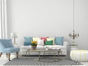 Summer home décor with colorful pillows and chairs in a white living room