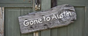 Sign on door about moving to Austin, Texas.