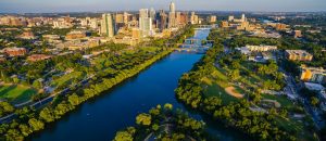 View over Town Lake and Zilker Park with the downtown Austin, Texas, buildings in the distance.